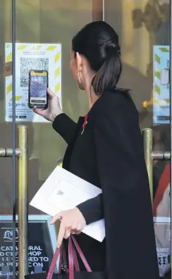  ?? PHOTO: GETTY IMAGES ?? Recording informatio­n . . . Prime Minister Jacinda Ardern scans a Covid19 QR code at the state memorial service for Prince Philip, Duke of Edinburgh, at the Wellington Cathedral of St Paul yesterday.