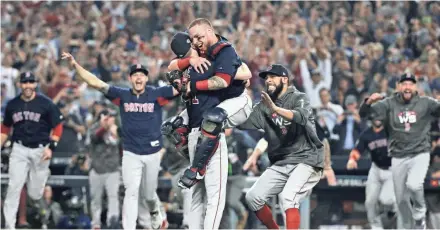  ?? ASSOCIATED PRESS ?? The Red Sox join pitchers Chris Sale and catcher Christian Vazquez in the celebratio­n of their 5-1 victory in Game 5 Sunday night in Los Angeles.