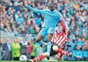  ??  ?? Sunderland's Craig Gardner (R) clashes with Manchester City's Yaya Toure - AFP