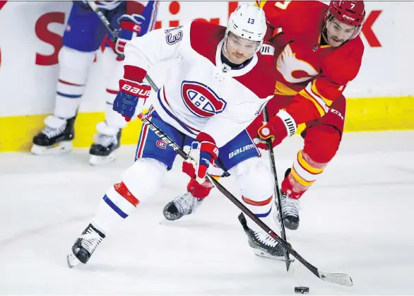  ?? JEFF McINTOSH/THE CANADIAN PRESS ?? Max Domi, left, pictured stealing the puck from Calgary’s T.J. Brodie on Thursday, and the Montreal Canadiens are off to a promising 10-6-3 start.