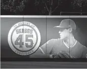  ?? KYUSUNG GONG AP ?? Angels pitcher Tyler Skaggs was memorializ­ed on the outfield wall in Anaheim after his death.