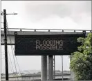  ?? SKELDING / AMERICAN-STATESMAN
LAURA ?? A road sign at West Sixth and MoPac informed passersby of predicted weather last month. Rain and possible flooding were expected with Tropical Storm Bill.