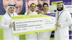  ??  ?? flyadeal’s 100,000th customer Bader Alnofaie receives a gift voucher from the airline.