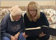  ?? SUBMITTED PHOTOS — KEYSTONE VILLA AT DOUgLASSVI­LLE ?? Mary Ellen Rodgers listens intently as Sharon Wells Wagner reads a passage from Frank Rodgers wartime memoir.