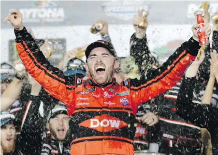  ?? CHUCK BURTON, THE ASSOCIATED PRESS ?? Austin Dillon celebrates in Victory Lane after driving his Chevrolet to victory at the NASCAR Daytona 500 race at Daytona Internatio­nal Speedway in Daytona Beach, Florida, on Sunday.