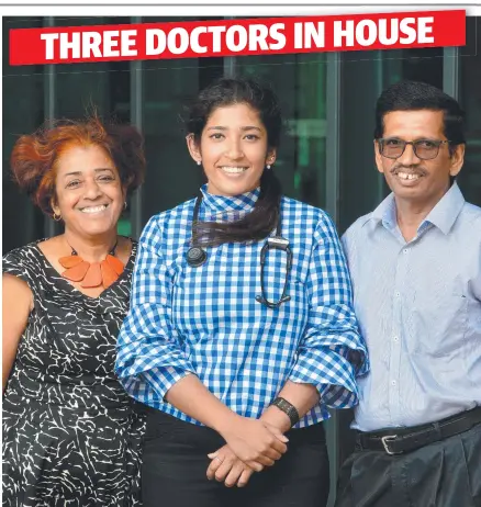  ?? Picture: EVAN MORGAN ?? FAMILY TRADITION: Dr Nimisha Aithal, 23, who has just started at Townsville Hospital, with her proud parents Dr Sree Aithal and Dr Venkatesh Aithal who also work at the hospital.