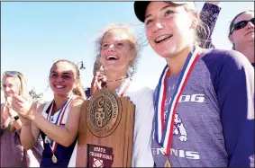  ?? NWA Democrat-Gazette/FLIP PUTTHOFF ?? Members of the Fayettevil­le girls tennis team celebrate with the trophy after winning the Class 7A team title Tuesday in Bentonvill­e. It was the Lady Bulldogs’ first state title since 1982.