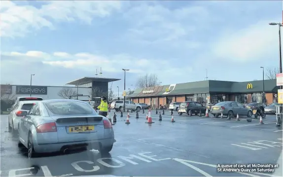  ??  ?? A queue of cars at Mcdonald’s at St Andrew’s Quay on Saturday