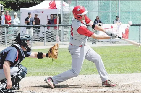  ?? — Photo by Joe Gibbons/the Telegram ?? Corner Brook Barons catcher Darren Colbourne looks on as St. John’s Winmar Capitals third-baseman Cory Ewart connects for a hit off of Barons pitcher Myles Vincent (not shown), during Game 1 of the teams’ best-of-seven provincial senior A baseball...