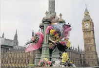  ??  ?? Floral tributes