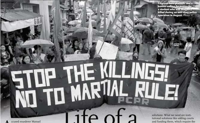  ?? Photo: IC ?? Filipinos hold placards and a banner calling for justice for a student who was allegedly killed during an anti-drug police operation in August.