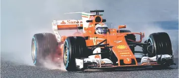  ??  ?? Ferrari’s Finnish driver Kimi Raikkonen drives at the Circuit de Catalunya in Montmelo, on the outskirts of Barcelona. — AFP photo