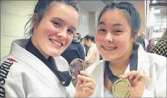  ?? SUBMITTED PHOTO ?? Alicia Thomas, right, with fellow Lennox Island Judo Club member, Loren Enman, displaying their medals form a recent Eastern Canadian judo competitio­n. Thomas is competing in the Elite national championsh­ips in Montreal, Que., this weekend.