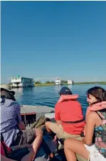  ??  ?? CLASSIC ROAD TRIP BIG WATERS. Reader Lourens Swanepoel (above left) catches tiger fish near Maun. Stay on a houseboat (above right) on the Okavango Panhandle near Seronga.