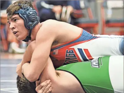  ?? Michelle Petteys, Heritage Snapshots ?? Heritage’s Alex Eacret pins his Murray County opponent during a 195-pound bout at Senior Night for the Generals last week.