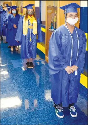  ??  ?? Maddie Alleman (right) leads classmates onto the basketball court.