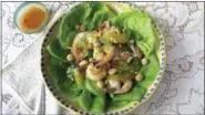  ?? SARA MOULTON VIA AP ?? This photo shows a shrimp, avocado and orange salad with spicy orange dressing in New York. This dish is from a recipe by Sara Moulton.