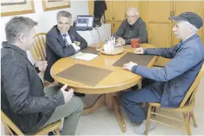  ?? ANDY MAXWELL MAWJI ?? Alberta Human Services Minister Irfan Sabir, second from left, and Ryan Geake, executive director of Calgary SCOPE Society, first from left, visit Harold Gregory, background, and Loyd Thornhill in a Calgary group home on Friday,
