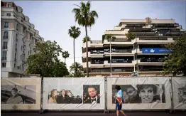  ?? ASSOCIATED PRESS PHOTO ?? A person walks along the Croisette ahead of the Cannes film festival, in Cannes, southern France. The 77th edition of the film festival runs from May 14 until May 25.