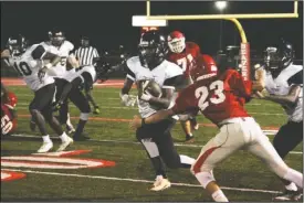  ?? The Sentinel-Record/Rebekah Hedges ?? BREAKING FREE: Hot Springs’ Spencer Johnson breaks free of a tackle by Glen Rose’s Wesley Launius (23) during Tuesday night’s scrimmage in Glen Rose.