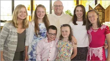  ??  ?? Fr John Hennebry with his nieces and nephew.