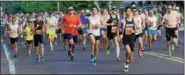  ?? JOHN STRICKLER — DIGITAL FIRST MEDIA FILE PHOTO ?? Runners take off from the starting line on College Drive competing in the 2015 Pottstown Half Marathon.