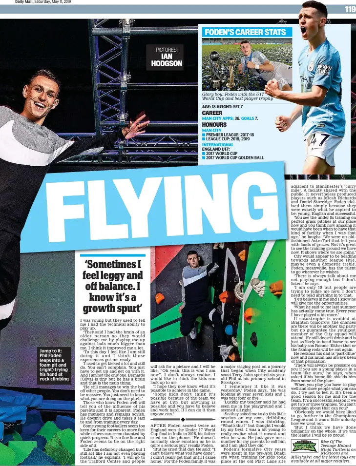  ??  ?? Jump to it: Phil Foden leaps into a foam pit and (right) trying his hand at rock climbing