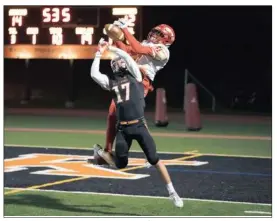  ??  ?? Bethel Park’s Austin Lewis battles for a pass against Penn Hills’ Dante Cephas.