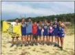  ?? NATE BARNES — THE NEWS-HERALD ?? NDCL’s boys cross country team holds its plaque after winning the team title at the Berkshire Early Bird Invitation­al Aug. 25.