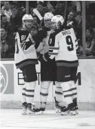  ?? DANNY WILD/USA TODAY SPORTS ?? Winnipeg center Mark Scheifele celebrates his second-period goal against the Rangers Tuesday night with teammates Kyle Connor and Alex Iafallo.