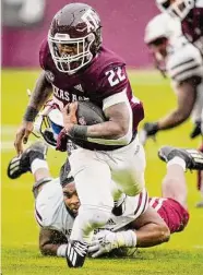  ?? ?? Texas A&M’s Le'Veon Moss rushed for 78 yards on 12 carries and a touchdown.