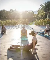  ??  ?? Strike a pose: A morning yoga class is given on the tour