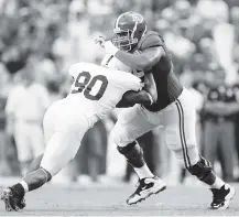  ?? KEVIN C. COX Getty Images ?? Dolphins offensive lineman DJ Fluker (76), here with the Alabama Crimson Tide, will miss several weeks after having minor knee surgery.