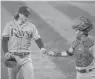  ?? JULIO CORTEZ/AP ?? Rays pitcher Tyler Glasnow, left, talks with catcher Michael Perez after pitching to the Orioles during the fifth inning of a game Sept. 18 in Baltimore.