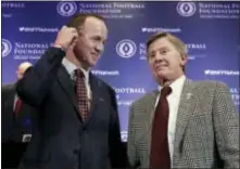  ?? RICHARD DREW — THE ASSOCIATED PRESS ?? Former University of Tennessee quarterbac­k Peyton Manning, left, and former University of Florida coach and QB Steve Spurrier get together after a news conference of the National Football Foundation and College Football Hall of Fame in New York Tuesday.