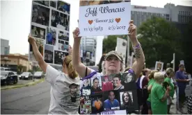  ?? ?? People hold signs for loved ones lost to opioid overdoses during a protest at Purdue Pharma headquarte­rs in Stamford, Connecticu­t, in August 2018. Photograph: Jessica Hill/AP