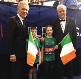  ??  ?? Tiernan Cooke from Tubbercurr­y and Mila Clancy from Gurteen at the Milrose Games in New York with Eamonn Coghlan. Both Mila and Tiernan took part in the Fastest Kid in the World Race.