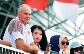  ?? PROVIDED TO CHINA DAILY ?? British rowing legend and current Team China performanc­e director Steve Redgrave watches the Asian Games women’s double sculls competitio­n in Palembang on Aug 23.