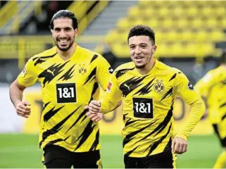  ?? /Reuters ?? Goal getter: Jadon Sancho, right, celebrates scoring against Arminia Bielefeld with Dortmund teammate Emre Can.