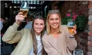  ?? Photograph: Paul Faith/AFP/Getty Images ?? Two happy customers at a Belfast pub on 3 July – the day pubs reopened in Northern Ireland.