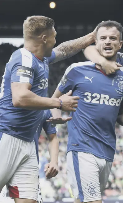  ??  ?? 0 Andy Halliday, centre, celebrates with Martyn Waghorn, left, and Kenny Miller after putting Rangers