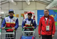  ?? PHILSTAR PHOTO ?? Filipino boxers Rogen Ladon and lightweigh­t Charly Suarez arrive in Rio De Janeiro, Brazil for the 2016 Olympics. Also in the photo is Philippine chef-de-mission Jose Romasanta.