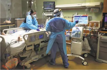  ?? Photos by Justin Sullivan / Getty Images ?? Nurses care for a COVID19 patient in the intensive care unit at Regional Medical Center in San Jose.