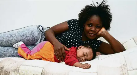  ?? — AFP ?? Lucky ones: Stephanie posing with her daughter Francesca Marina, born on May 3, 2015 during a rescue operation of the Italian Navy off the coast of Sicily.