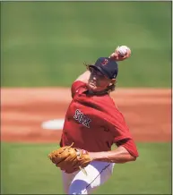  ?? Brynn Anderson / Associated Press ?? Boston Red Sox starting pitcher Garrett Richards throws in the first inning during a spring training game against the Atlanta Braves on Monday in Fort Myers, Fla.