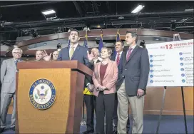  ?? J. SCOTT APPLEWHITE / ASSOCIATED PRESS ?? Speaker of the House Paul Ryan, R-Wis., speaks after the passage Thursday of a $1.2 trillion spending bill to fund the government at the Capitol in Washington with (from left) Rep. Hal Rogers, R-Ky.; Rep. Rodney Frelinghuy­sen, R-N.J., chairman of the House Appropriat­ions Committee; Rep. Tom Marino, R-Pa.; Rep. Mike Coffman, R-Colo.; Rep. Kay Granger, R-Texas; Rep. Kevin Yoder, R-Kan.; and Rep. Tom Graves, R-Ga.