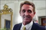 ?? PABLO MARTINEZ MONSIVAIS — THE ASSOCIATED PRESS ?? In this photo, Sen. Jeff Flake, R-Ariz. walks to his seat as he attends a luncheon with other GOP Senators and President Donald Trump at the White House in Washington. When President Trump takes the stage this week at a rally in Phoenix, Arizona, the...