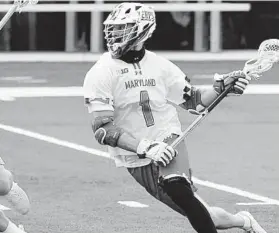  ?? ULYSSES MUÑOZ/THE BALTIMORE SUN ?? Maryland attackman Jared Bernhardt, shown in a game earlier this season, led the unbeaten Terps to a rout of Rutgers on Saturday.