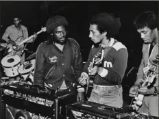  ?? Kate Simon via The New York Times ?? Aston Barrett, center left, the reggae bassist who rose to fame with Lee “Scratch” Perry’s Upsetters and played on Bob Marley’s biggest hits, and continued to tour with the Wailers after Marley’s death. died at a Florida hospital on Feb. 3 after a long medical battle. He was 77.