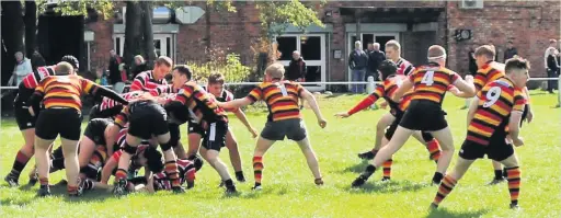  ??  ?? ●●Heaton Moor Junior Colts push Altrincham Kersal back during the weekend’s clash